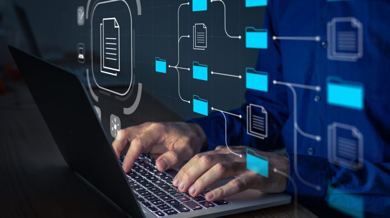 a person working on a laptop with an graphic representation of process discovery