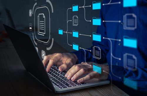 a person working on a laptop with an graphic representation of process discovery